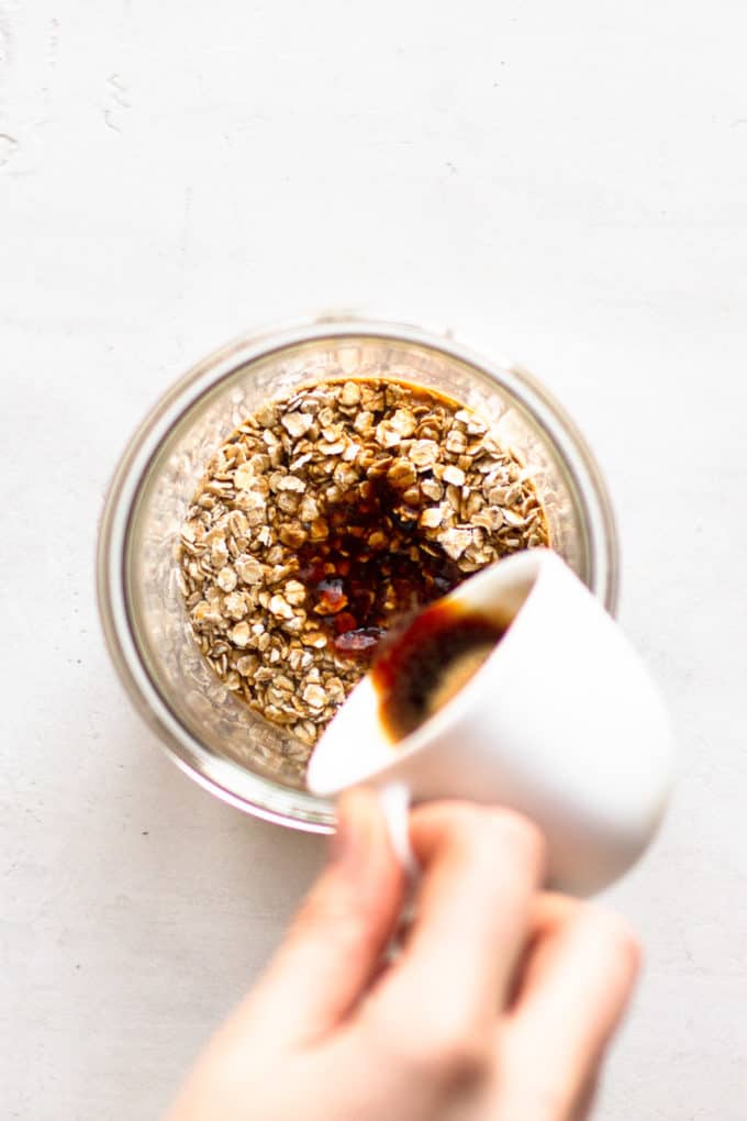coffee being poured into a cup of oats