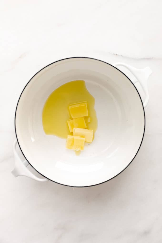 butter and oil in a white pot