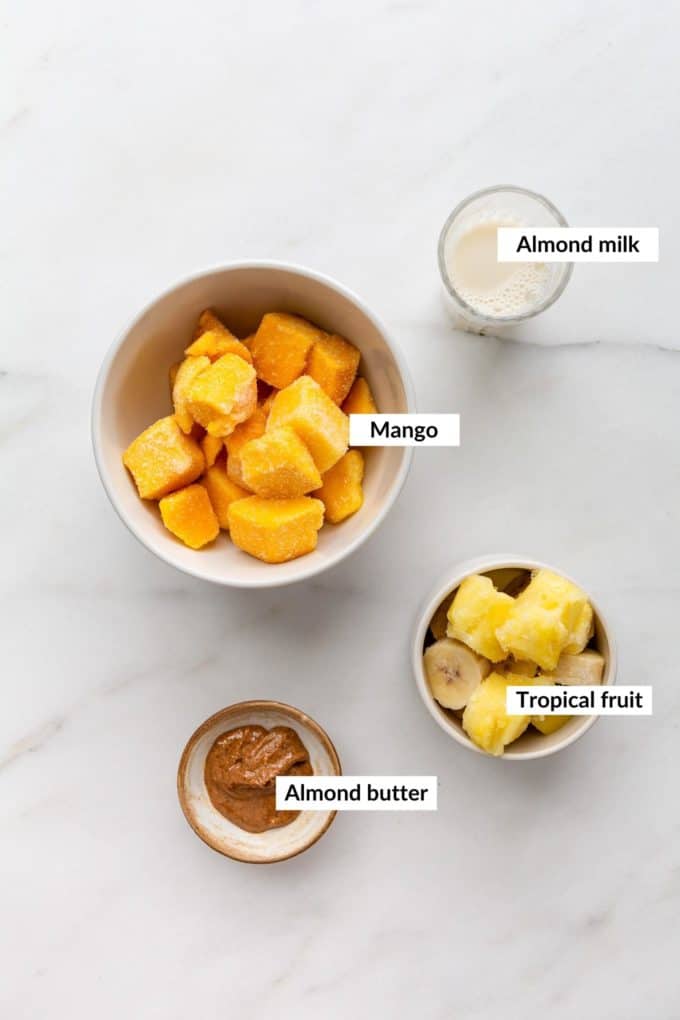 Ingredients for a mango smoothie bowl