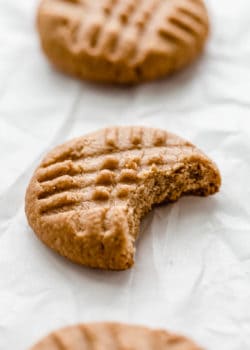 a peanut butter cookie with a bite taken out of it
