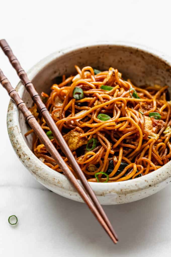 Mie goreng noodles in a white speckled bowl