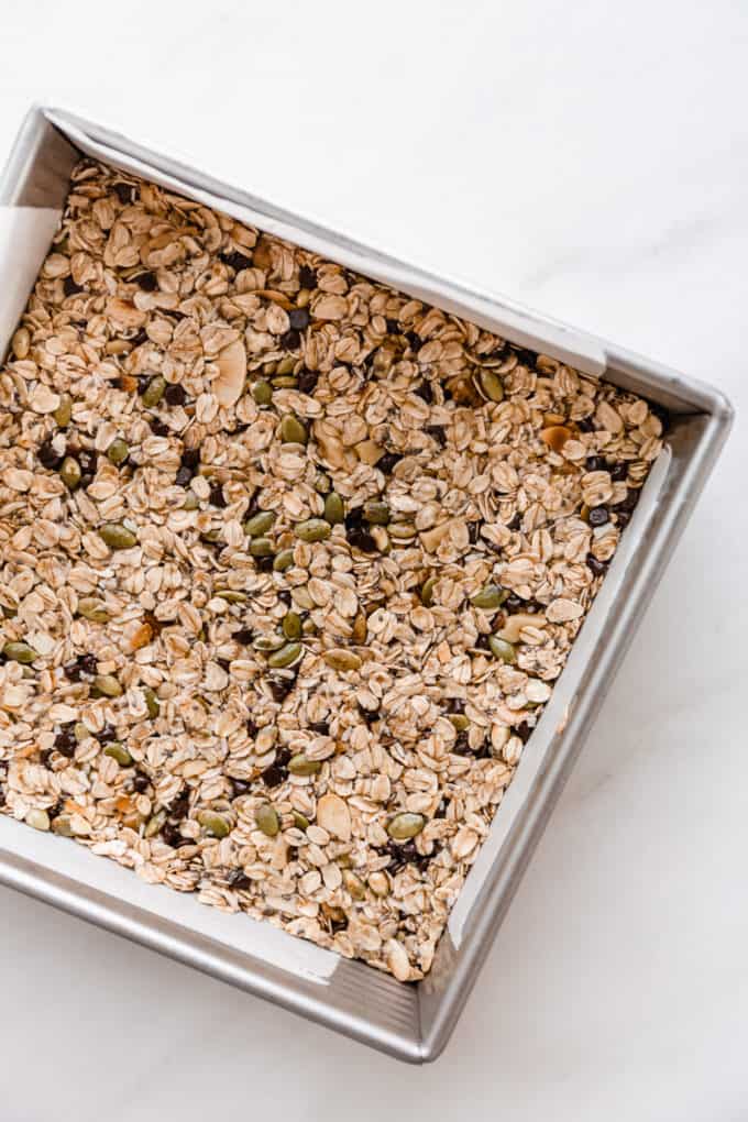 unbaked muesli bars in a square pan