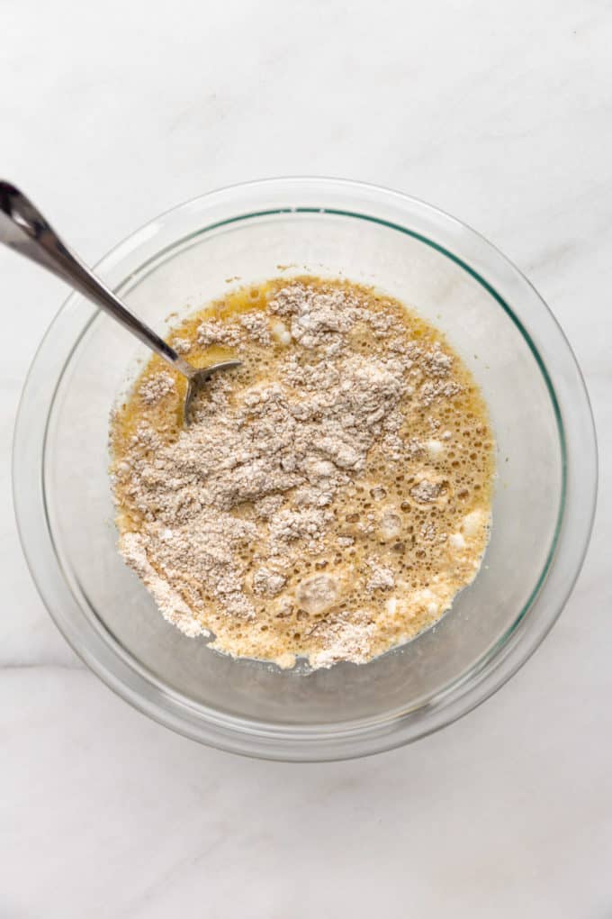 oat flour, eggs and milk in a mixing bowl