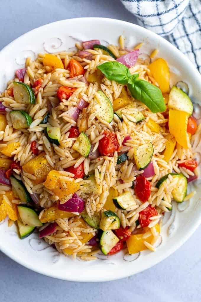 orzo pasta with roasted vegetables in a bowl