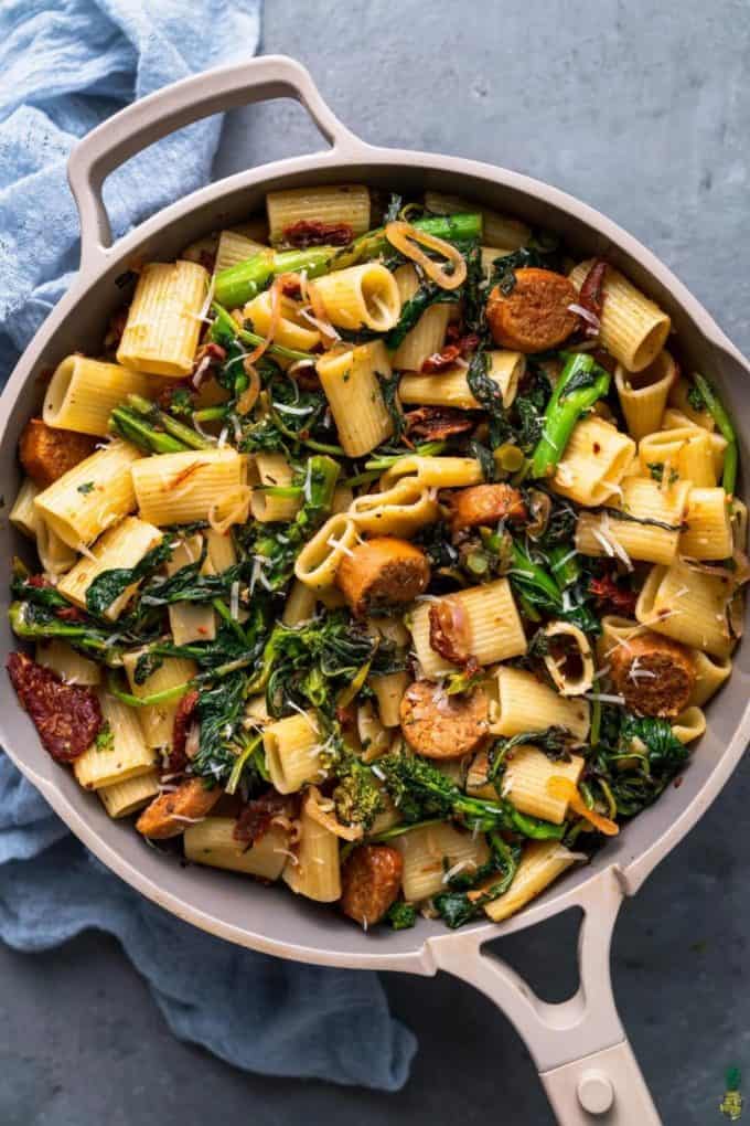rigatoni, broccoli rabe and sausage in a grey pan