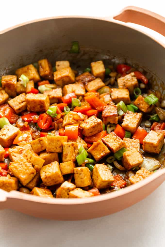 kung pao tofu in a pink pan