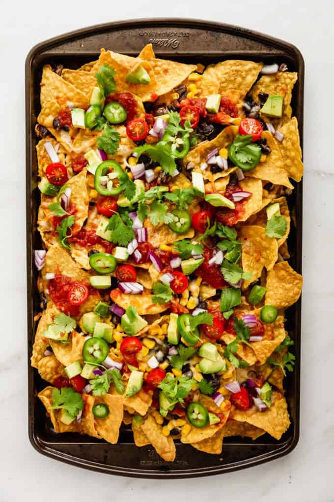 nachos on a baking sheet