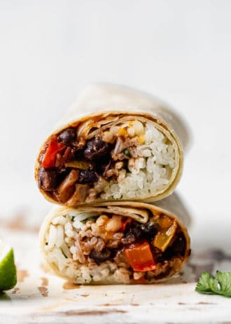 two veggie burritos stacked on top of each other