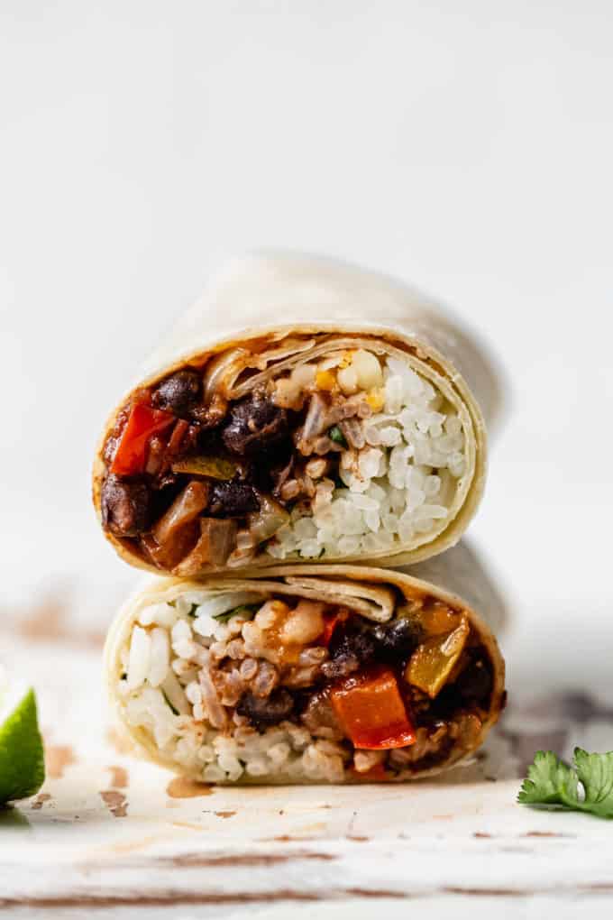 two veggie burritos stacked on top of each other