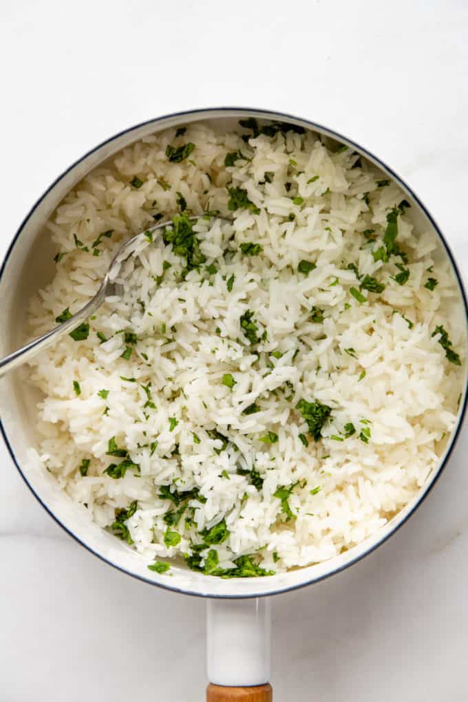 rice with cilantro in a white pot
