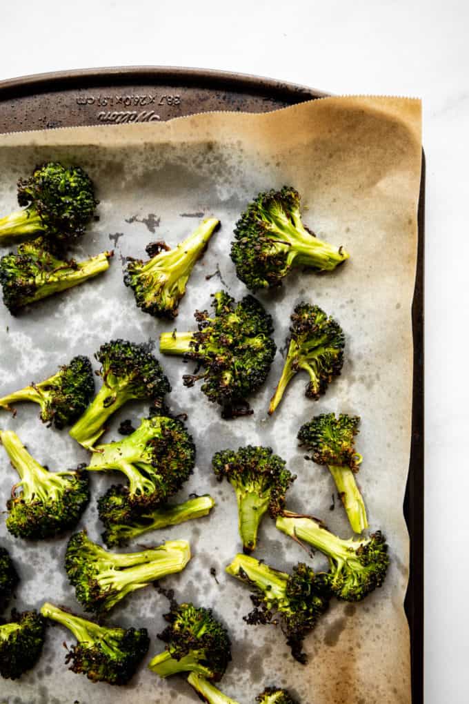 roasted broccoli florets on a baking sheet
