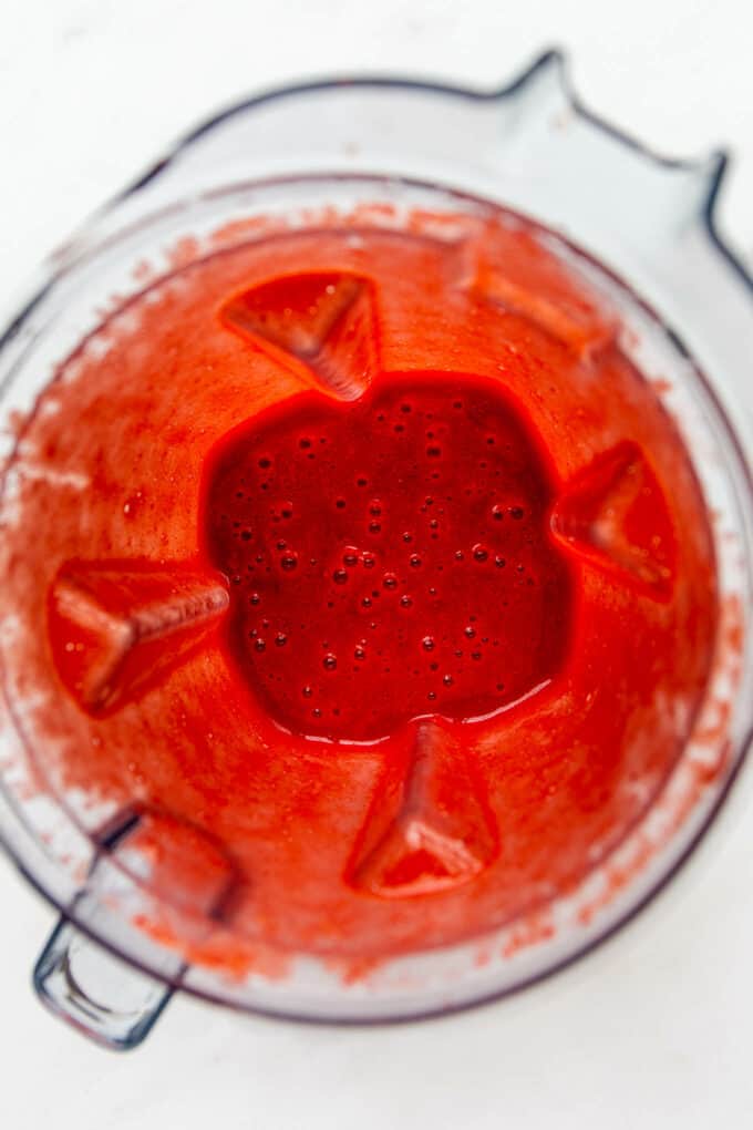 blended strawberries in a blender