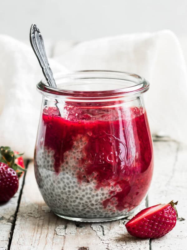 a jar of chia pudding with strawberry rhubarb compote