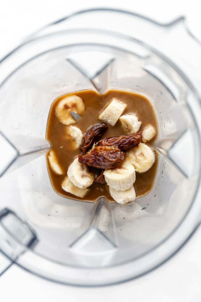 bananas, dates, coffee and almond milk in a blender