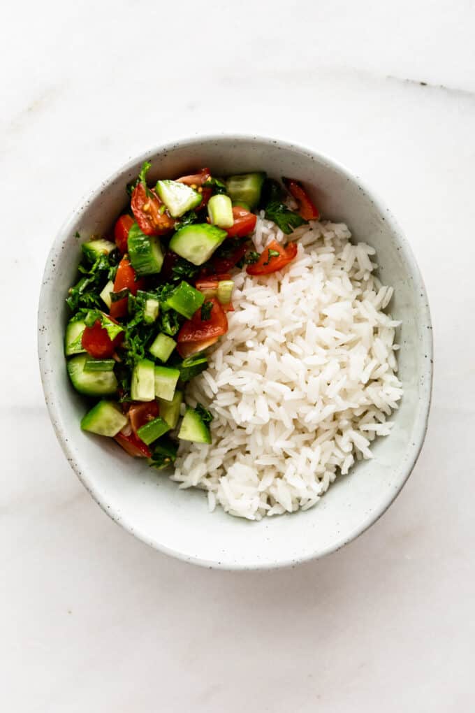 rice and Israeli salad in a bowl