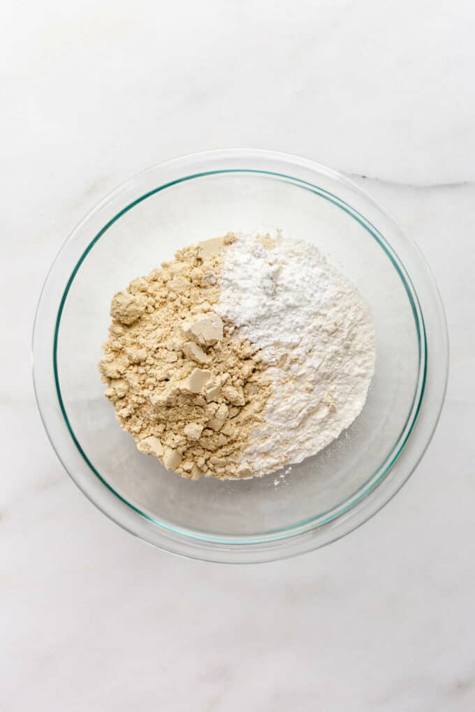 flour, protein powder and baking powder in a clear bowl