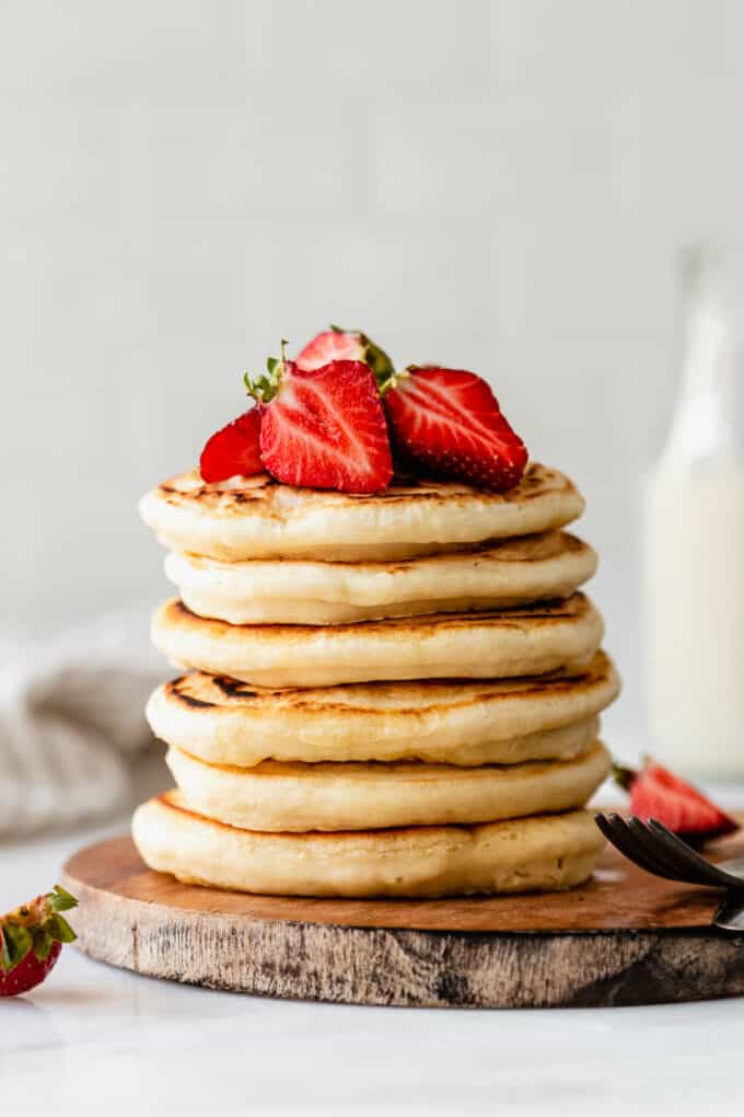 a stack of protein pancakes with strawberries on top
