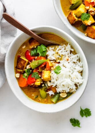 a bowl of massaman curry with rice