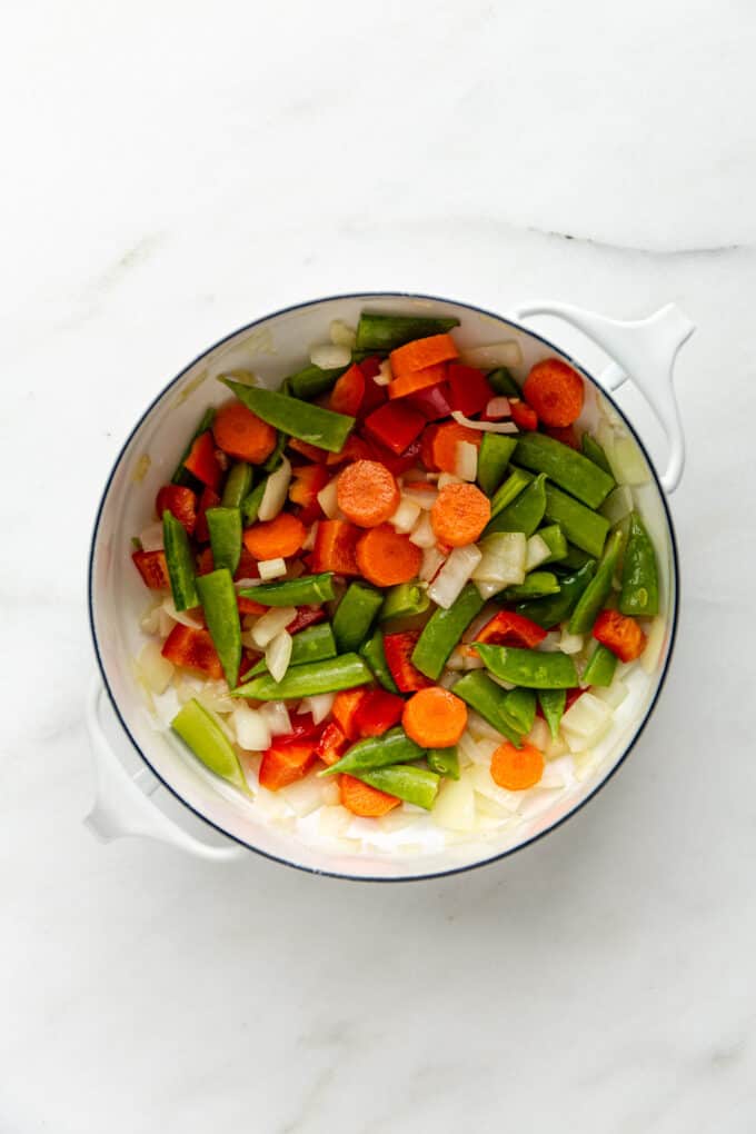 sauteéd vegetables in a white pot