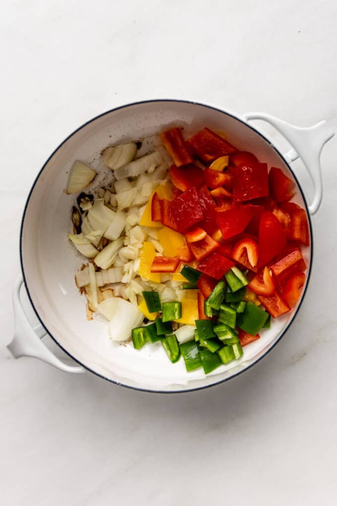 garlic, onion and peppers in a white pot