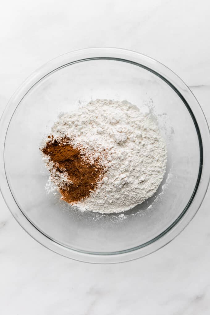 flour and cinnamon in a clear mixing bowl