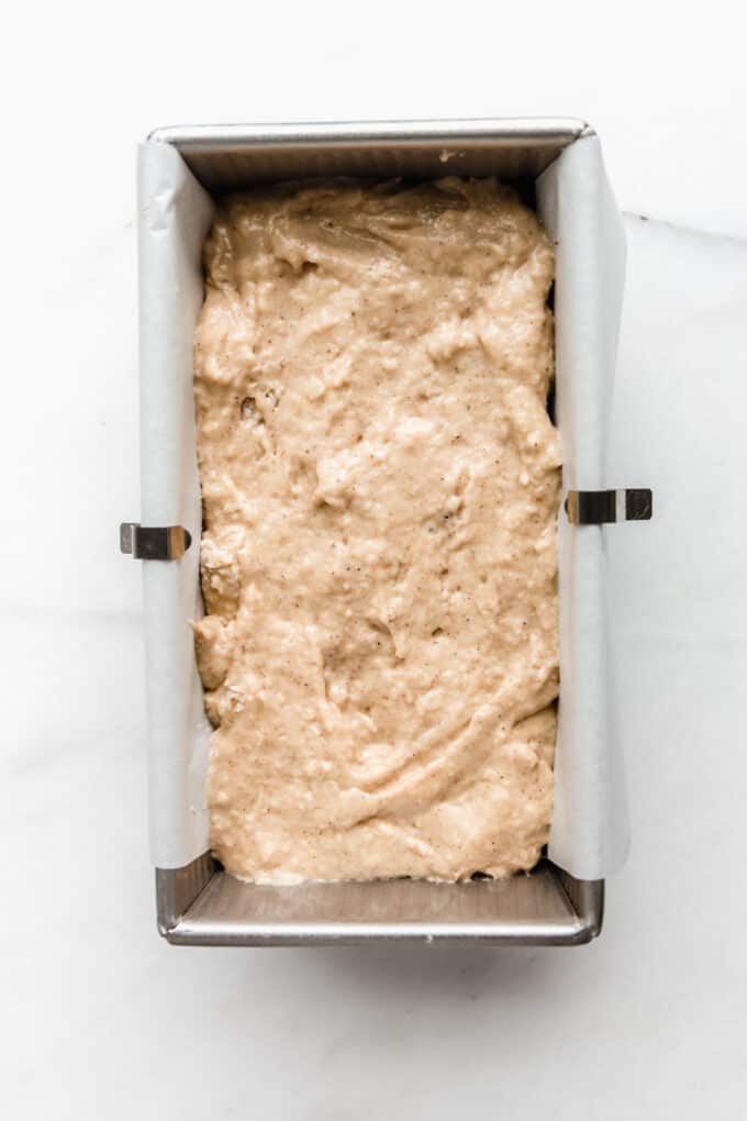 apple bread batter in a loaf pan
