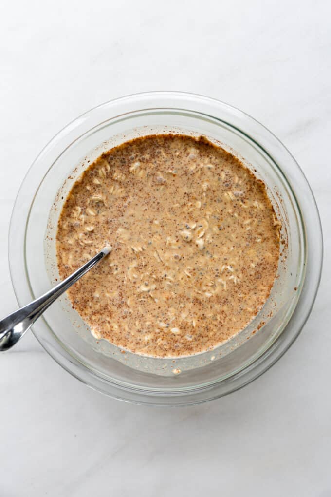 pumpkin overnight oats in a clear mixing bowl