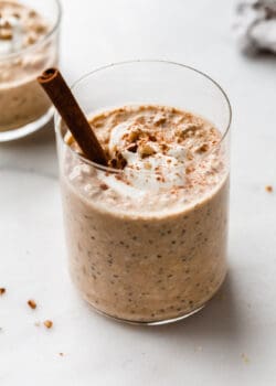pumpkin overnight oats with a cinnamon stick in it