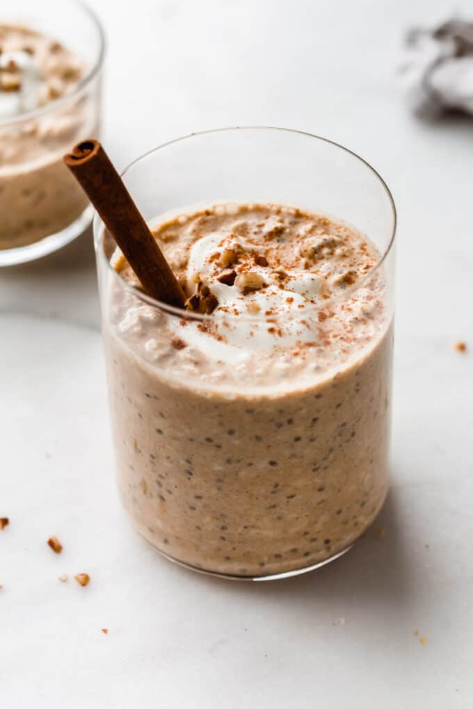 pumpkin overnight oats with a cinnamon stick in it