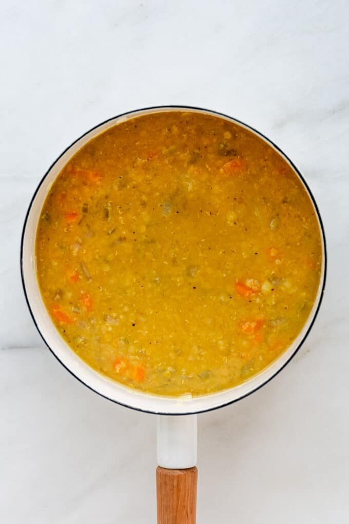 lentil soup in a white pot