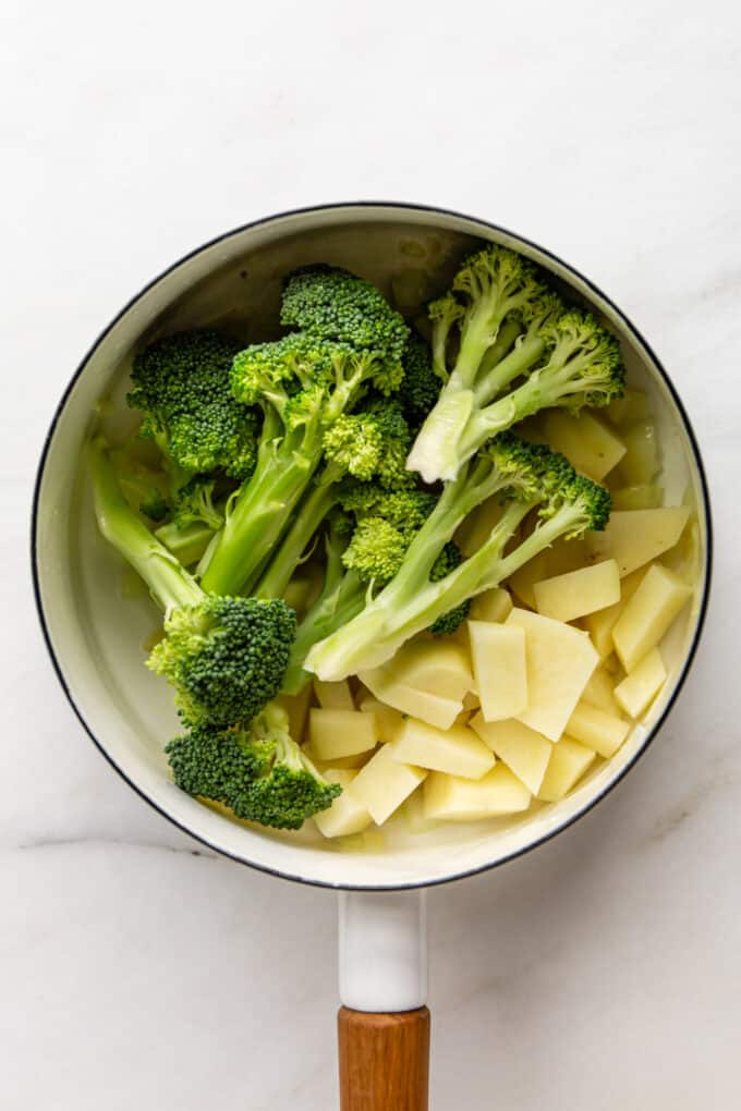 broccoli and potato in a white pot