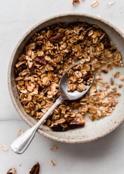 maple pecan granola in a bowl with a spoon