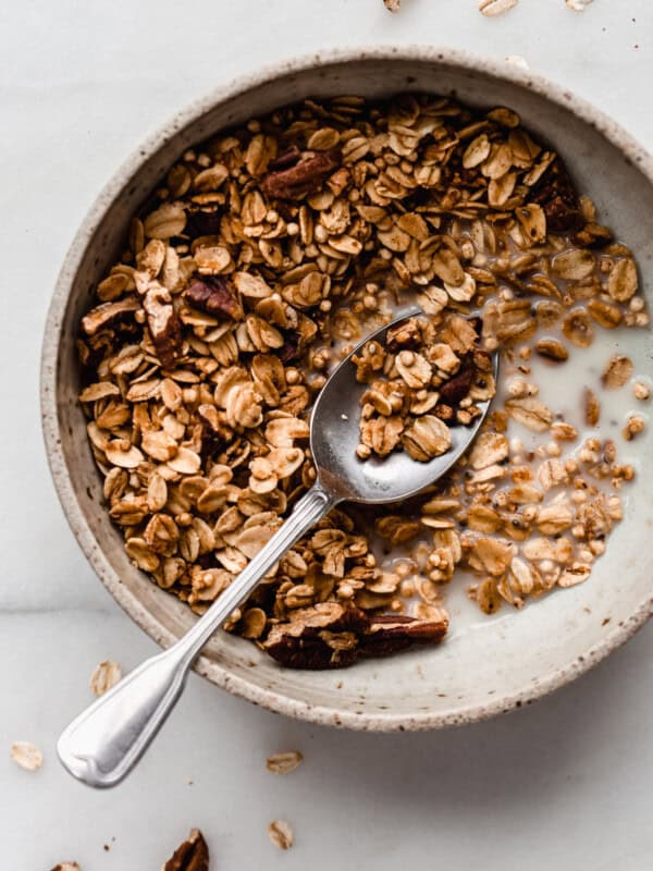 maple pecan granola in a bowl with a spoon