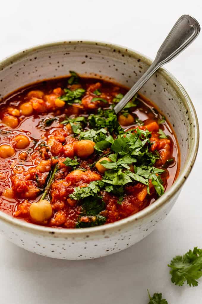 Moroccan chickpea stew in a bowl topped with cilantro