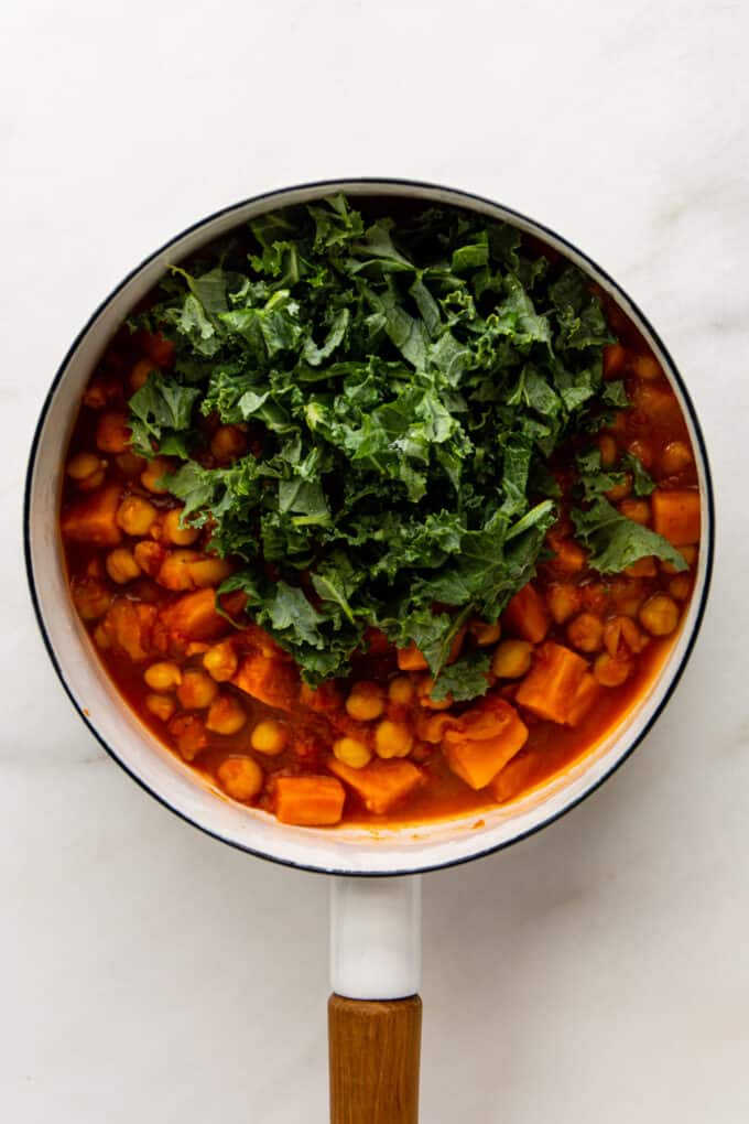 Moroccan chickpea stew with kale in a pot