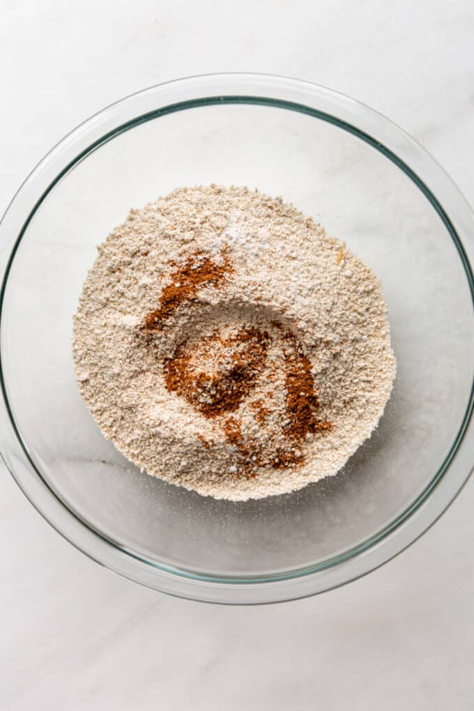 oat flour and pumpkin spice in a clear mixing bowl