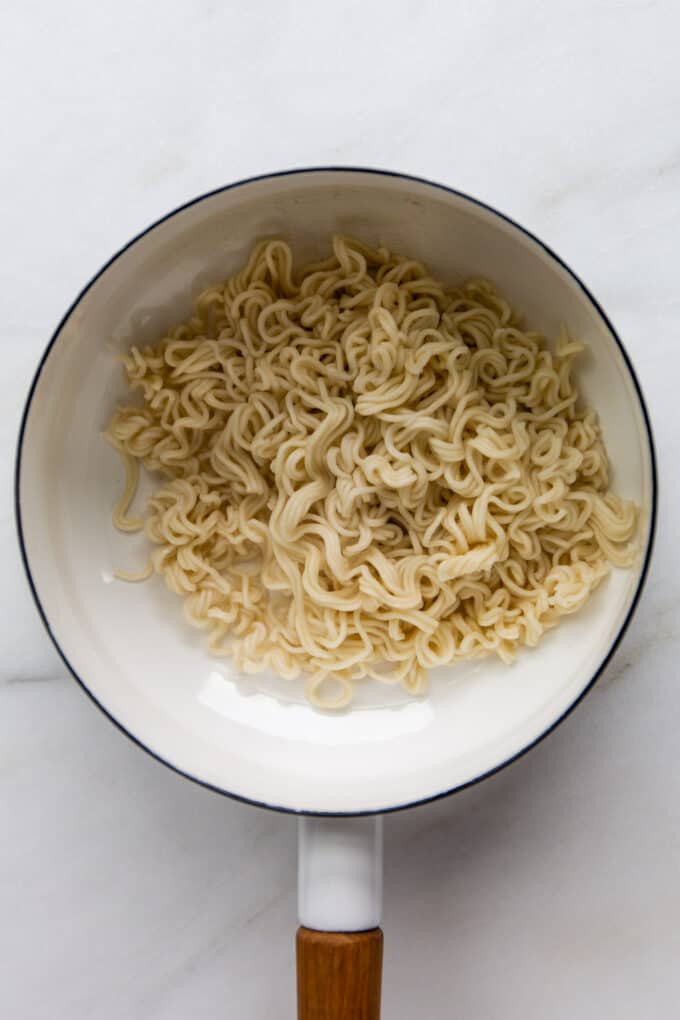 ramen noodles in a white pot