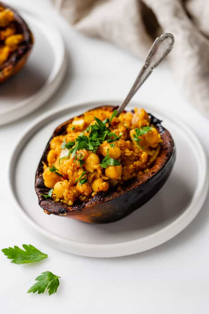 vegetarian stuffed acorn squash with a fork on it