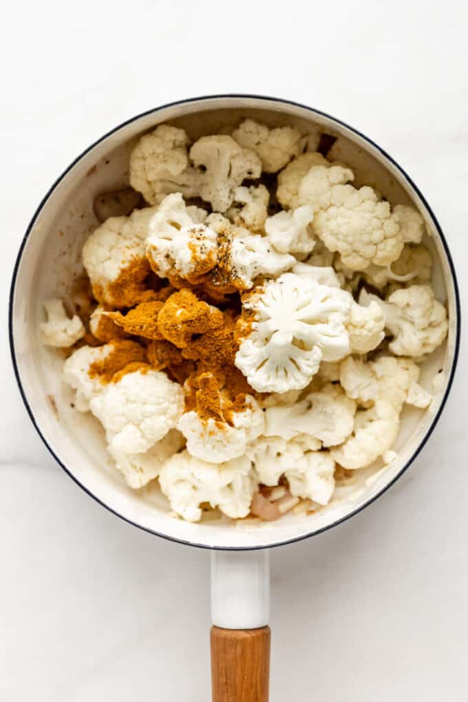 cauliflower and spices in a white pot