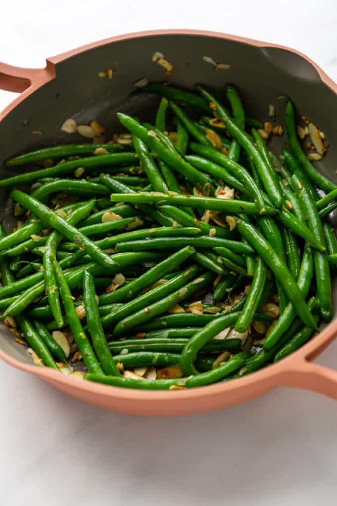 green beans sautéed in a pan with almonds