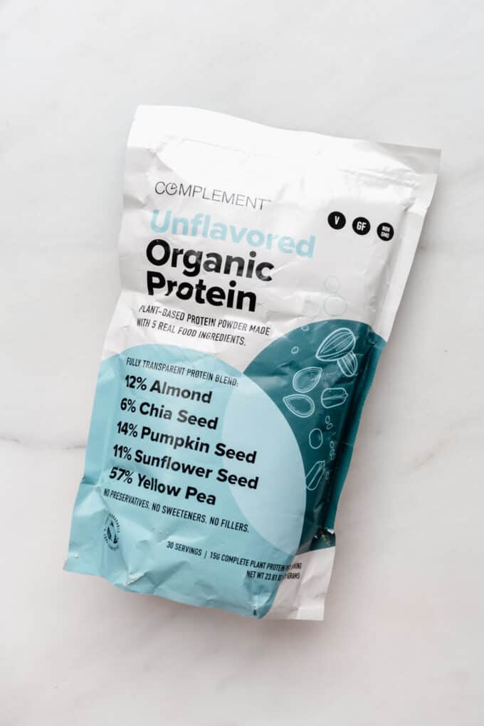 a bag of unflavoured protein powder on a marble counter