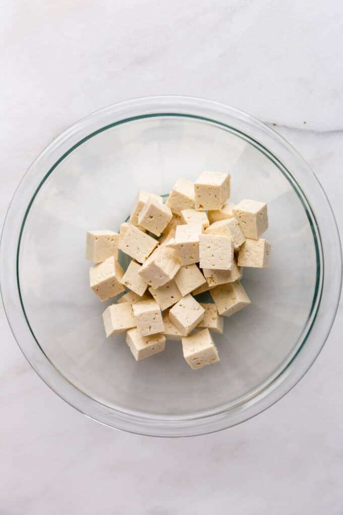 cubes of tofu in a mixing bowl