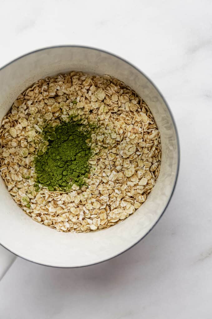 oats and matcha powder in a white pot