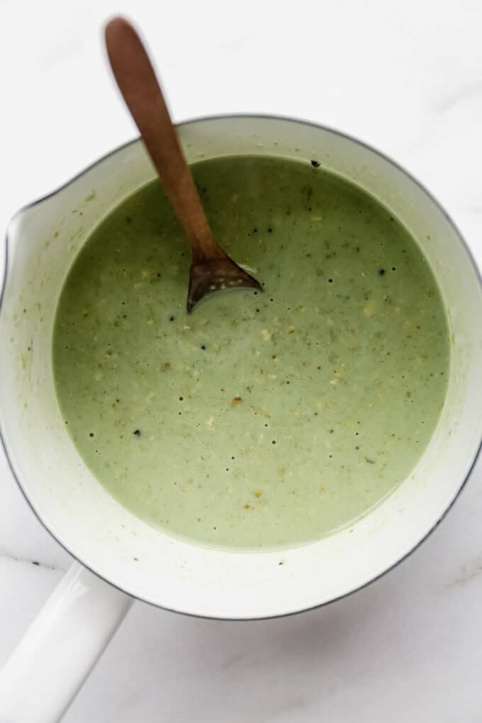 oat, matcha and oat milk in a white pot