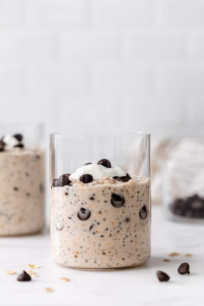 two cups of cookie dough overnight oats with chocolate chips and yogurt