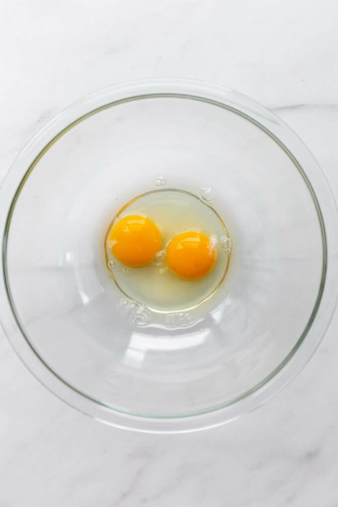 2 eggs in a mixing bowl