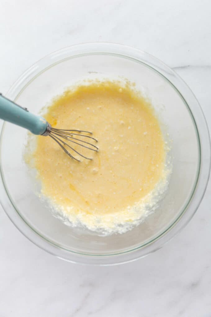 eggs and cottage cheese whisked together in a bowl