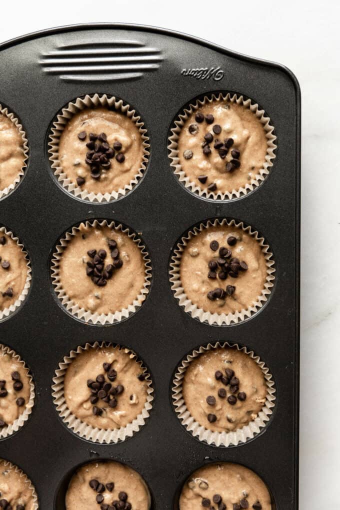 unbaked oat flour banana muffins in a baking pan