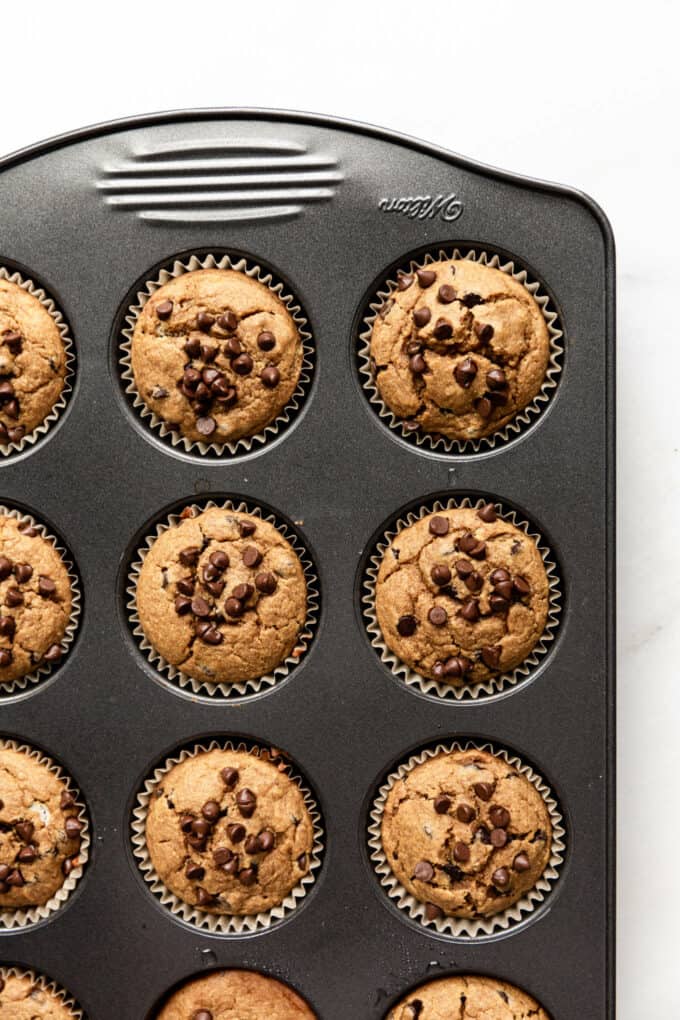 oat flour banana muffins baked in a muffin pan
