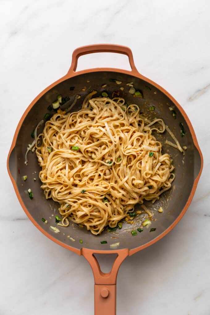 sesame noodles in a pink pan